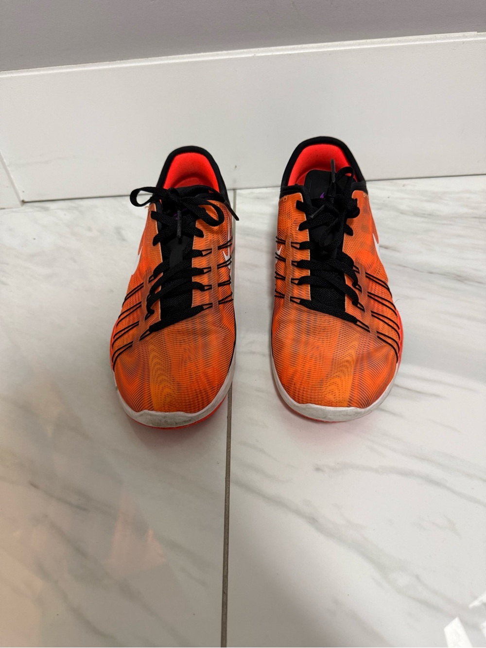 Nike Women’s Orange Sneakers with White Swoosh and Black Accents